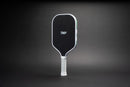 TMP Stealth Pickleball Paddle from Tickle My Pickle, angled view showing the TMP-branded black face with white frame, on a black gradient background
