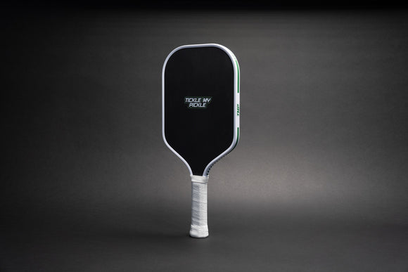 TMP Stealth Pickleball Paddle front view with the Tickle My Pickle wordmark on the black face, against a black gradient background